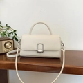 Chic cream-colored small square handbag with silver metal buckle and top handle - White