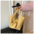 Bright yellow litchi grain leather bucket bag with matching mini pouch charm and top handle - Yellow