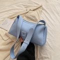 Chic light blue pleated crossbody bag with matching shoulder strap and sleek texture - Blue