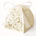 Elegant laser-cut floral wedding favor box in cream white with a sheer organza ribbon bow - Ivory
