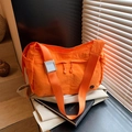Vibrant orange nylon crossbody bag with wide shoulder strap and dual zipper closure - Orange