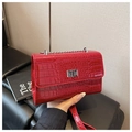 Detail of red crocodile texture crossbody bag with silver metal twist lock closure - Red