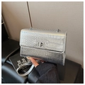 Detail of silver crocodile-patterned chain bag with metallic texture and turn-lock - Silver