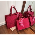 Detail of red wedding tote bags with floral embroidery and festive bow ribbon decoration - Large / Burgundy