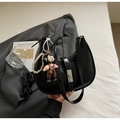 Detail of black pleated hobo bag with silver buckle and pearl chain on suit fabric - Black with Pendant