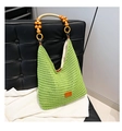 Detail of green crochet tote bag with round wooden bead handle and orange leather patch - Green