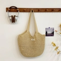 Oatmeal crochet mesh shoulder bag with a woven brand label and minimalist paper rope design - Khaki