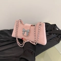 Pink suede baguette bag with a silver metallic bow and chain strap for women - Pink