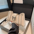 Cream bow baguette bag with silver chain strap presented in an elegant gift box - White