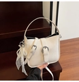 Elegant cream white shoulder bag with decorative bow and pearl charm on wooden stairs - White with Pendant