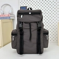 Dark gray waterproof nylon travel backpack with stylish black buckles and side pocket - Gray