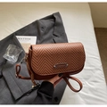 Brown woven crossbody bag in caramel leather with a circular silhouette and knot detail - Brown