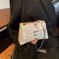 Chic cream white crossbody bag in glossy leather with silver chain strap and buckle detail - White