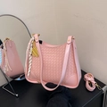 Pink quilted bucket bag with woven leather texture and elegant gold abacus charm - Pink