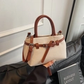 Elegante bolso tipo cubo de lona beige con ribete de cuero marrón y bandolera - Marrón