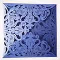 Macro view of laser-cut navy blue damask pattern wedding invitation sleeve card - Sapphire Blue