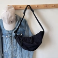Modern black nylon half-moon crossbody bag with adjustable strap on a hanger - Small / Black