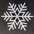 Detailed view of white hollowed snowflake coaster on a contrasting black background - Snowflake Style H(H)