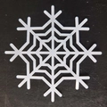 Macro shot of white hollow snowflake paper coaster with precise laser-cut patterns - Snowflake Style I(I)