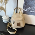 Beige waterproof nylon small crossbody bag with front zipper pocket and fabric strap - Rice White Small
