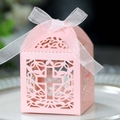 Elegant pink pearlized paper wedding candy box with laser-cut cross and ribbon bow - Hollow Cross Style (XTH-280)
