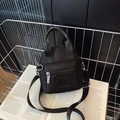 Mini black waterproof nylon crossbody bag with dual handles and adjustable strap - Black Small