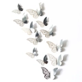 Macro view of 3D silver laser-cut butterfly wall stickers with mirrored metallic texture - Set / Mirror Silver
