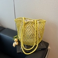 Yellow hollow out knit tote bag with a beige drawstring lining for beach vacation use - Yellow