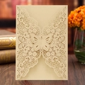 Champagne gold laser cut butterfly wedding invitation card on dark wood table - Beige Gold