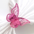 Laser-cut hollow butterfly napkin ring in metallic pink finish on white satin - Nail Powder