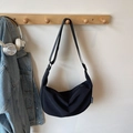 Minimalist black crescent crossbody bag with adjustable strap and side logo detail - Black without Pendant