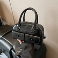 Glossy black shoulder bag with dual front pockets and silver hardware in vintage style - Black