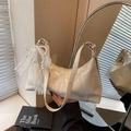 Creamy white hobo bag featuring pearl bow decoration and delicate lace trim details - With Charm / Off White