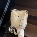 Bolso bandolera de lona crema con ribete de cuero marrón y correa ajustable - Caqui