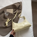 Minimalist beige hobo bag in glossy leather with adjustable strap and stitched details - No Pendant / Yellow