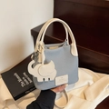 Chic light blue and white woven bucket bag with elephant charm and leather strap - Blue