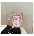 Pink bucket bag with silver studs, round metal handle, and drawstring interior detail - Pink