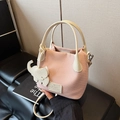 Pink woven bucket bag with lychee grain handles and cute white elephant charm - Pink