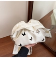 Chic off-white pleated bucket bag with silver chain strap and butterfly charms - White