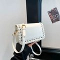 White faux leather shoulder bag with woven edges and gold buckle detail - White
