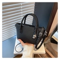 Detail of black lychee grain leather bucket bag with silver hardware and water drop pendant - Black