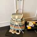 Colorful striped woven backpack with cream leather straps for summer vacation style - White