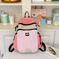 Detail of color-block nylon backpack with side water bottle pockets and brand logo - Pink
