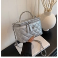 Silver quilted bucket bag with chain strap and metallic camellia flower detail - Silver