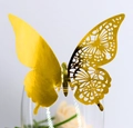 Detailed laser-cut golden butterfly decoration with floral hollow pattern on a glass rim - Double Sided Reflective Gold / Gold