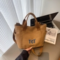 Brown canvas tote bag with TCT embroidery, detachable shoulder strap and side pockets - Brown