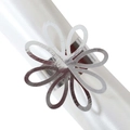 Macro shot of silver petal napkin ring with shiny finish and hollow flower design - Reflective Silver