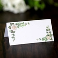 Elegant white tent place card with white rose floral design on dark wood table - Rose Print Style (XWK-199) / XWK-199