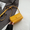 Yellow litchi grain square crossbody bag with CLEARIN logo on a grey suit jacket - Ginger Yellow (Without Pendant)