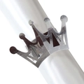 Macro detail of silver crown napkin ring with mirror polished finish on white silk - Reflective Silver